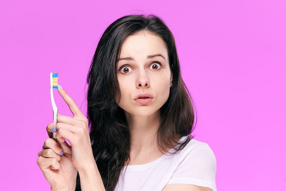 Woman with Toothbrush - surprised