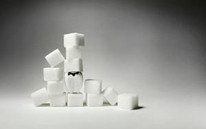 Healthy holiday alternatives featuring sugar cubes on a grey background.